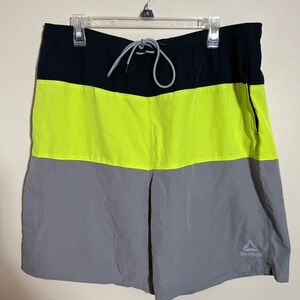Men’s Reebok swimsuit. Size xl. Side pockets and zippered back pocket.
